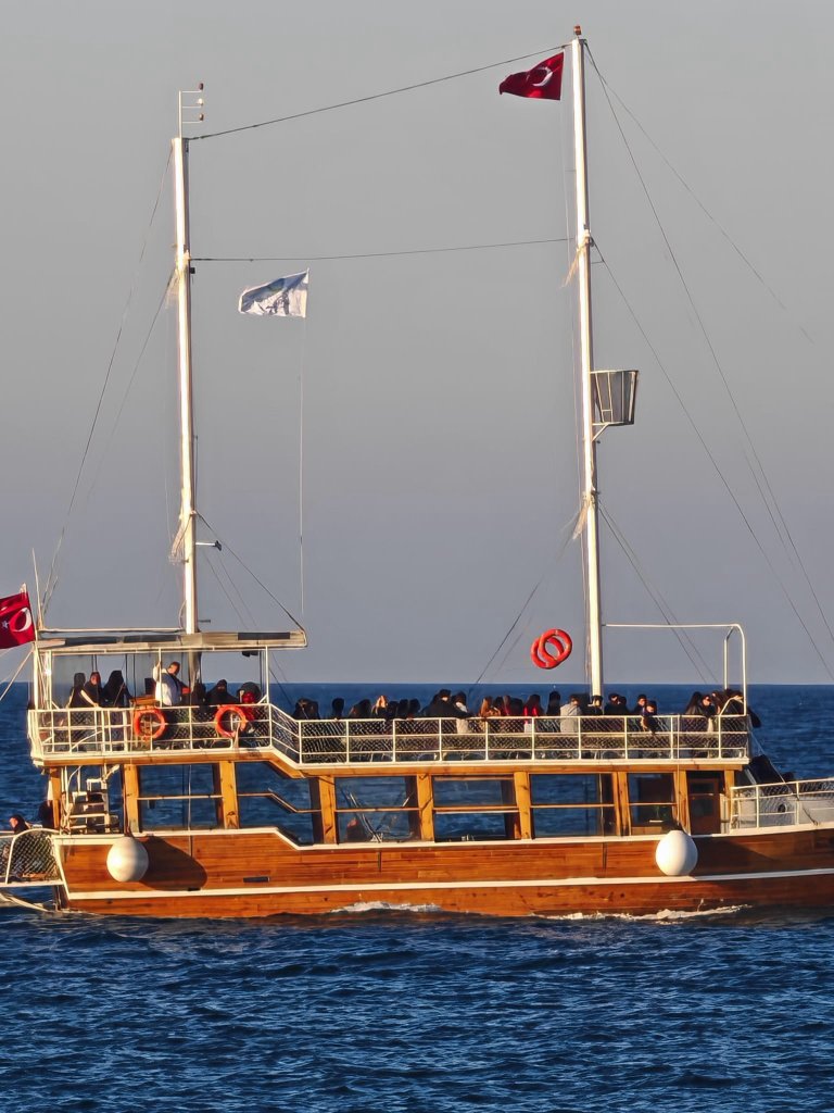 Wooden excursion boat on open sea