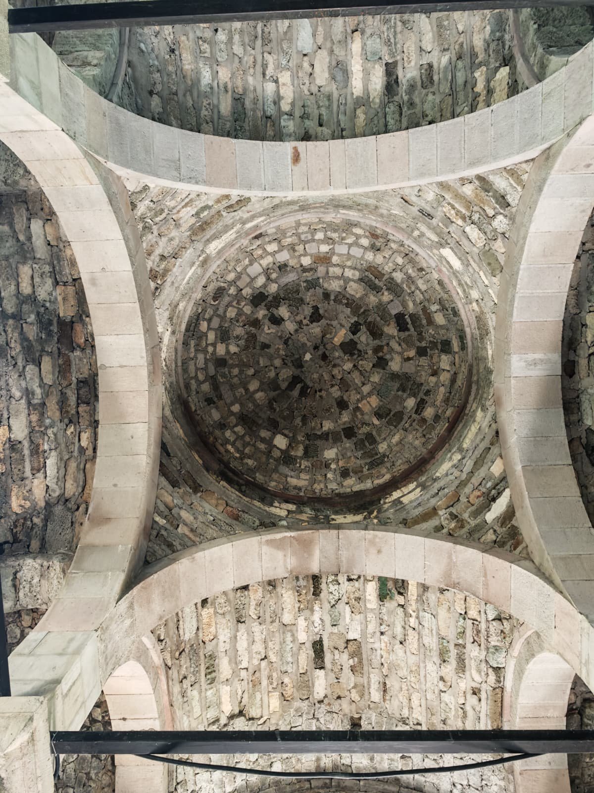 Looking up at a stone dome in Sumela Monastery